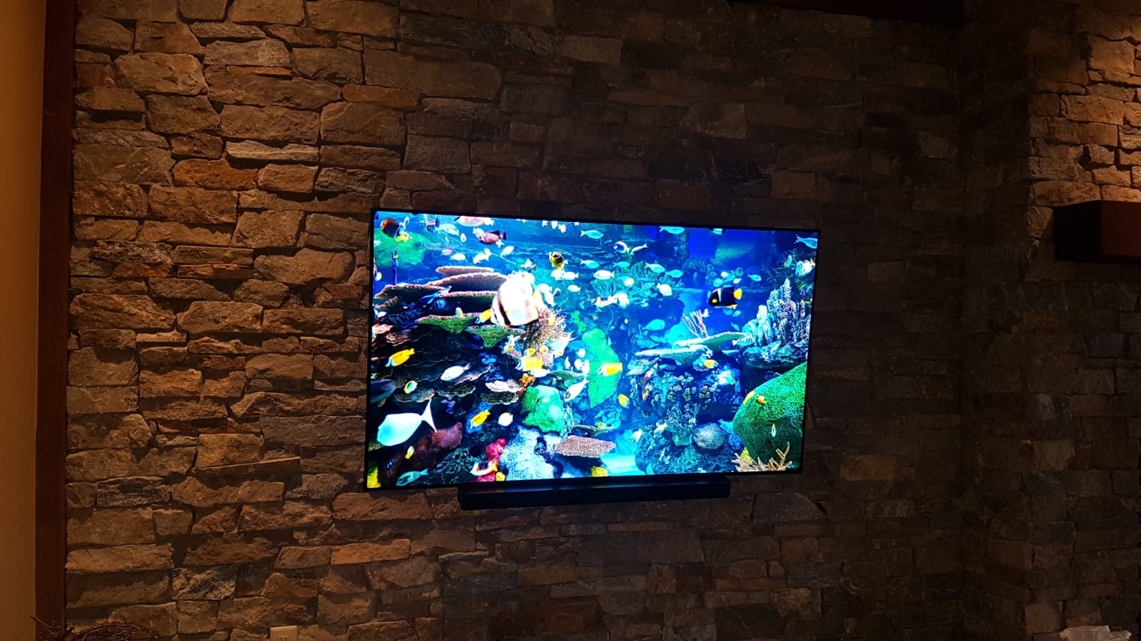 Modern TV Mounting | TV Mounting on Stone | Mervin Audio Visual TV mounting service in Kelowna